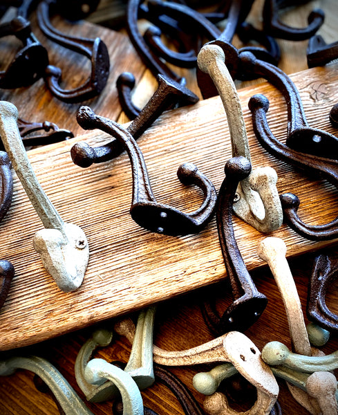 Three Cast Iron Wall Hooks on Reclaimed Barn Wood