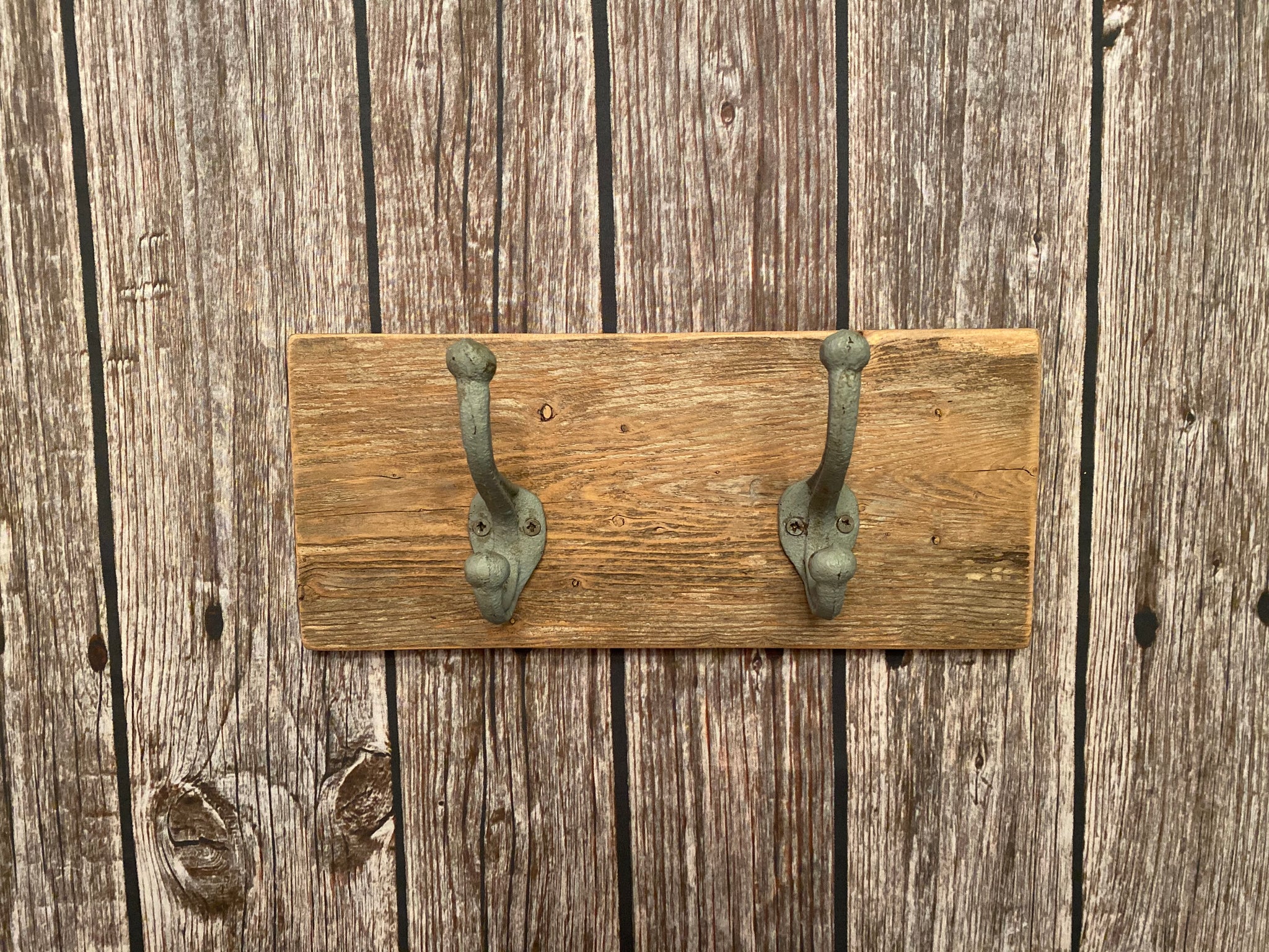 Two Cast Iron Wall Hooks on Reclaimed Barn Wood