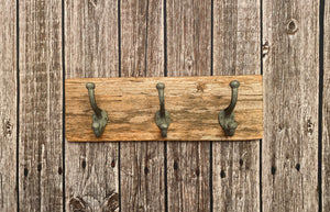 Three Cast Iron Wall Hooks on Reclaimed Barn Wood