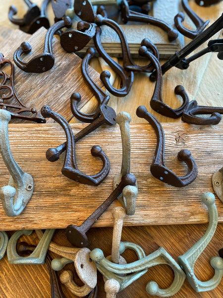 Three Cast Iron Wall Hooks on Reclaimed Barn Wood